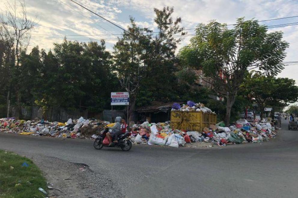 Garbage piles up in the streets of Palu in the wake of the earthquake and tsunami. 