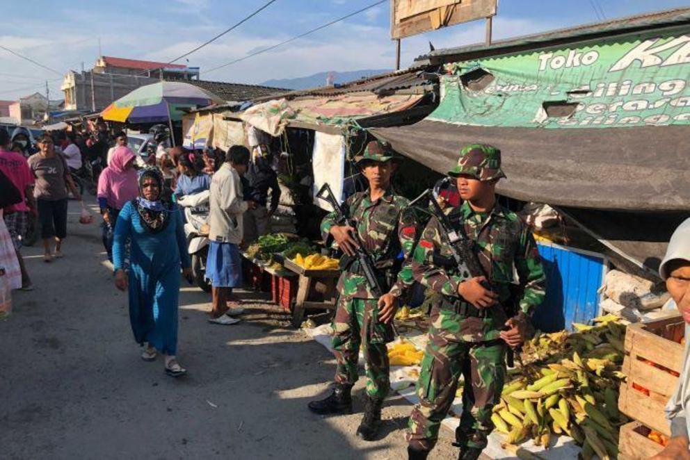 Soldiers patrolling the streets of Palu have brought looting under control.