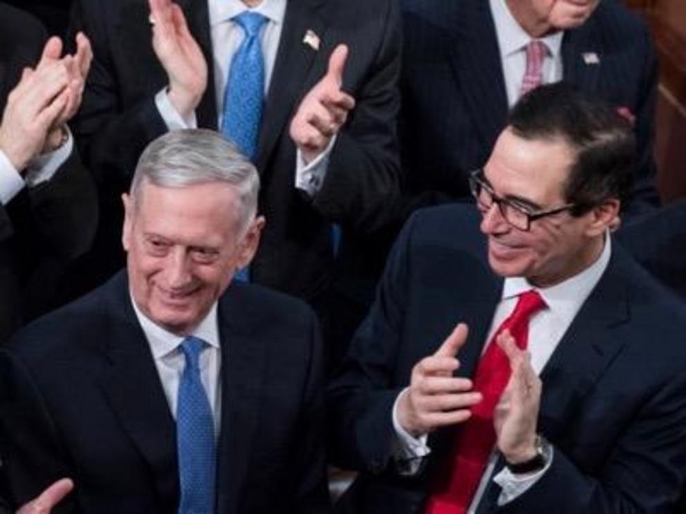 Secretary of Defense James Mattis applauded by United States Secretary of the Treasury, Steven Mnuchin.