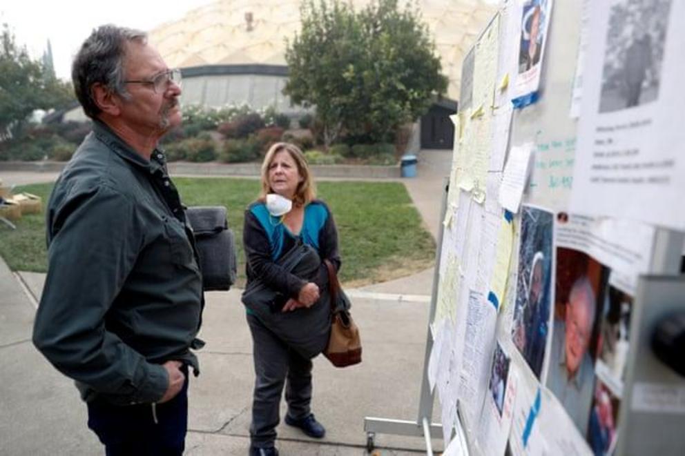 The Walkers look for people they know on a list of people missing in the aftermath of the Camp Fire in Chico. 