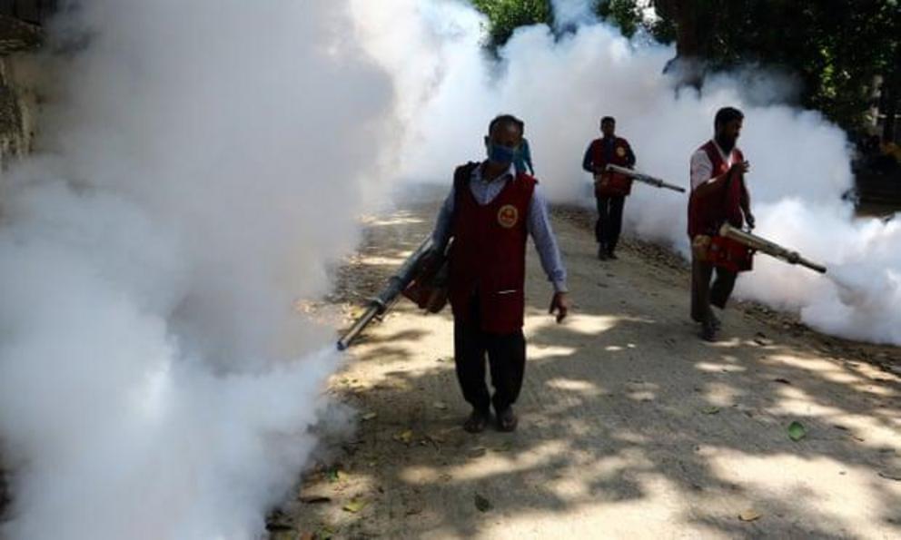 An employee of Dhaka North City Corporation sprays pesticides to kill mosquitoes. 