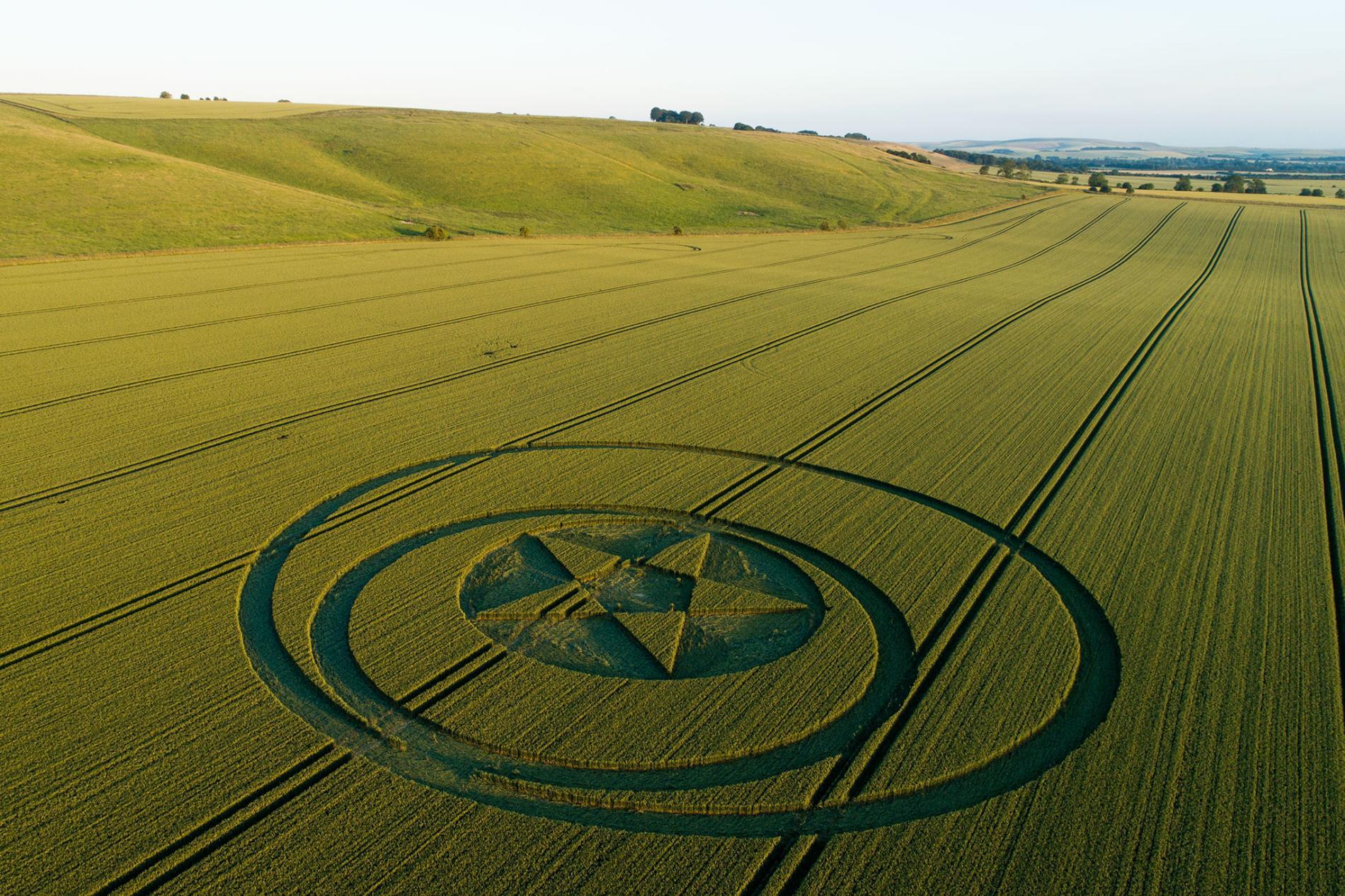 A crop circle near Hackpen Hill, Wiltshire, slices through a farm with surg...
