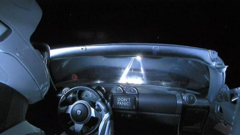Take another look at this photo. See anything on the dashboard? On a lark, SpaceX added a tiny Hot Wheels Tesla Roadster (complete with tiny Starman) on the dash for this flight. 