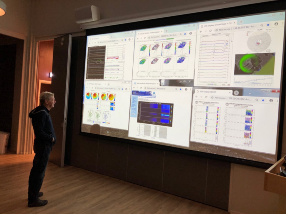 Who wouldn’t want a flashy wall of science like this? VISIONS-2 co-investigator Jim Hecht studies “the wall of science” used to display data that shows auroral conditions and forecasts.