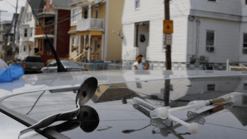 A syringe filled a narcotic, an empty syringe and a spoon sit on the roof of a car, where a man in his 20's overdosed on opioids in Lynn, Massachusetts, U.S., August 14, 2017. Picture taken August 14, 2017. | Photo: Reuters
