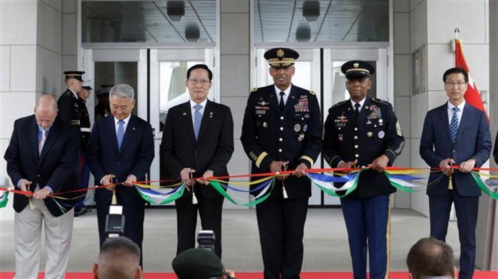 South Korean Defense Minister Song Young-moo, (3rd-L) and the chief of the US military forces Vincent Brooks (C) are pictured at during an opening ceremony for the new headquarters of the US Forces Korea (USFK) at Camp Humphreys in Pyeongtaek, South Korea