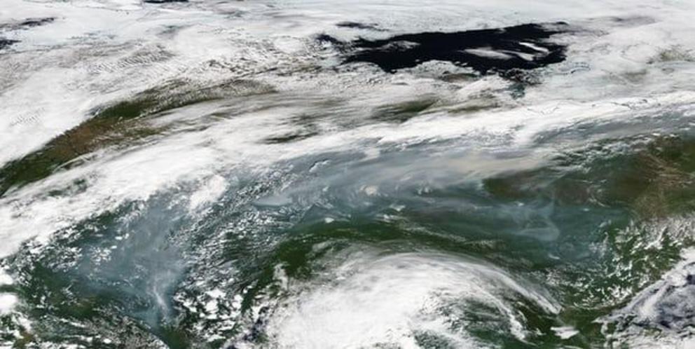 Satellite images show wildfire smoke over central Siberia on 3 July.