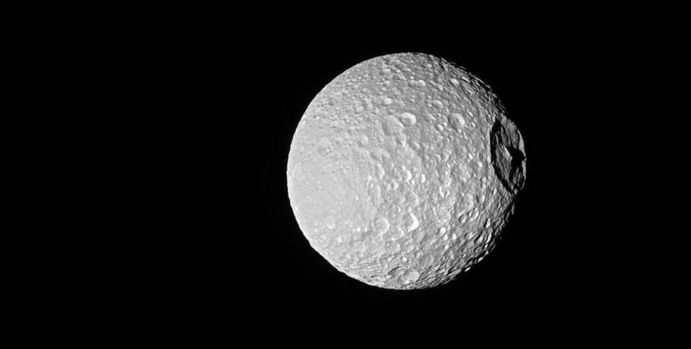 That’s no Death Star, it’s Saturn’s oddball moon, Mimas.