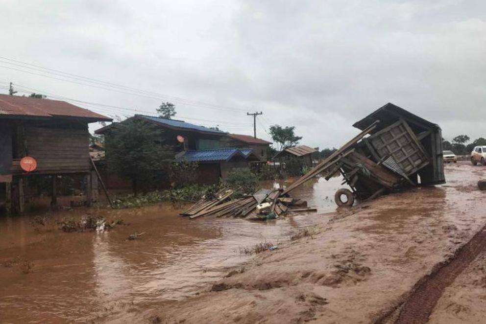 The dam wall collapse sent water rushing toward villages. 