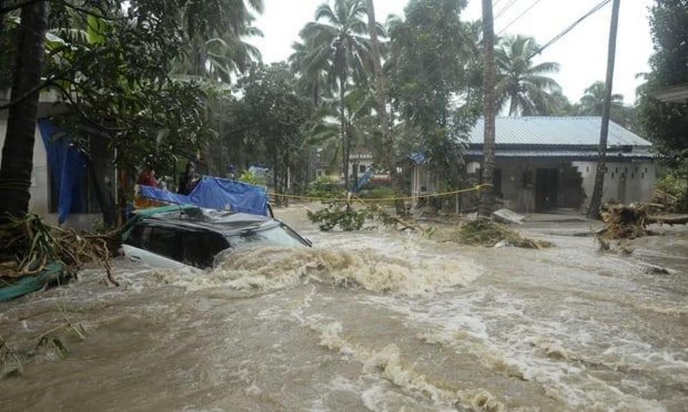 Floodwaters rush through Kozhikode, Kerala state.