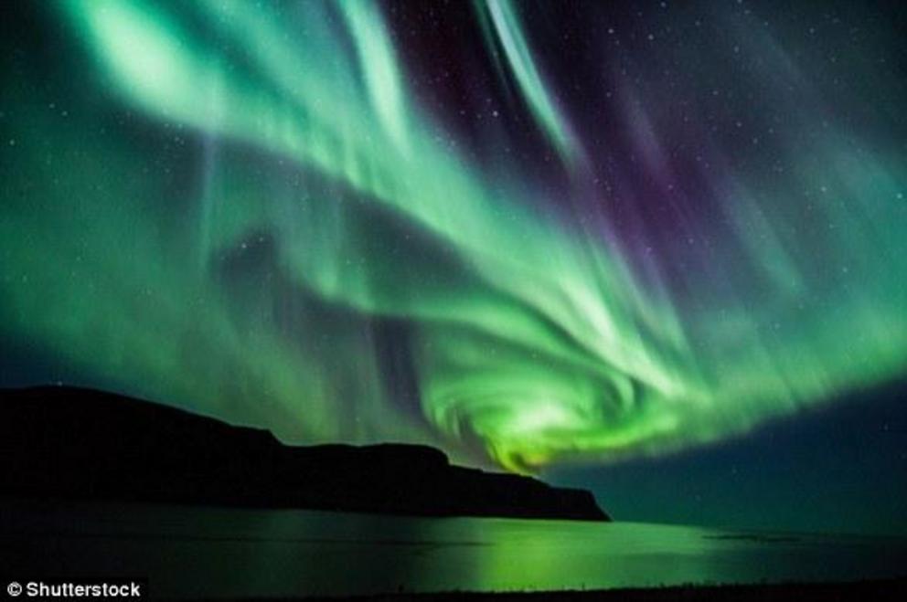 There are two types of Aurora - Aurora Borealis (file photo), which means 'dawn of the north', and Aurora Australis, 'dawn of the south.' The displays light up when electrically charged particles from the sun enter the Earth’s atmosphere