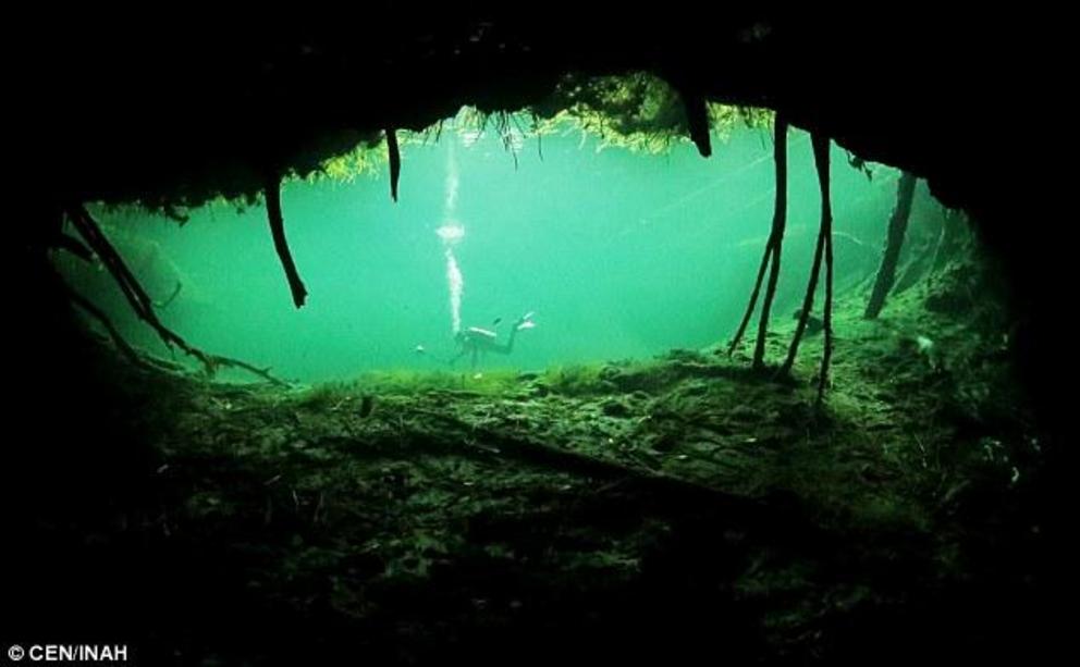 Eve’s remains were found about 386 meters beneath the surface of Naharon cenote (shown) – a 22.6 meter sinkhole in the cave system of Mexico's Quintana Roo
