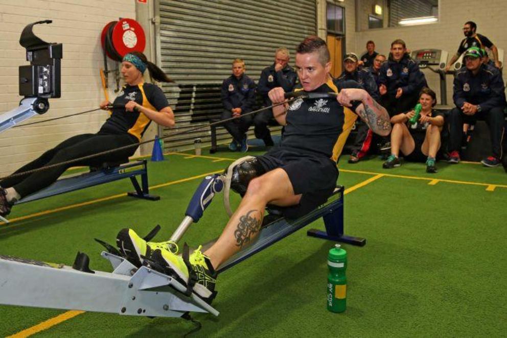 Corporal (RAAF) Melissa Roberts (left) and Corporal (Army) Sonya Newman take part in an indoor rowing competition at an Invictus Games training camp at the Sydney Academy of Sport and Recreation, NSW.