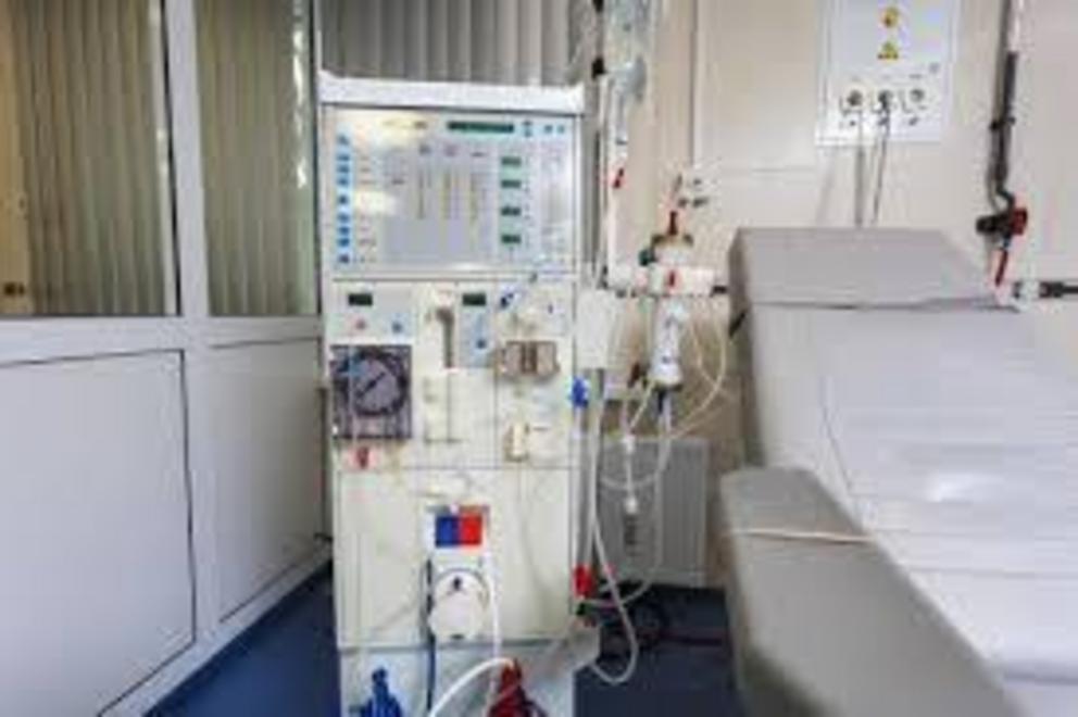 Dialysis requires hours of being tethered to a machine like the one above, but a new urea sorbent could accelerate development of a wearable artificial kidney. Credit: ElRoi/Shutterstock.com