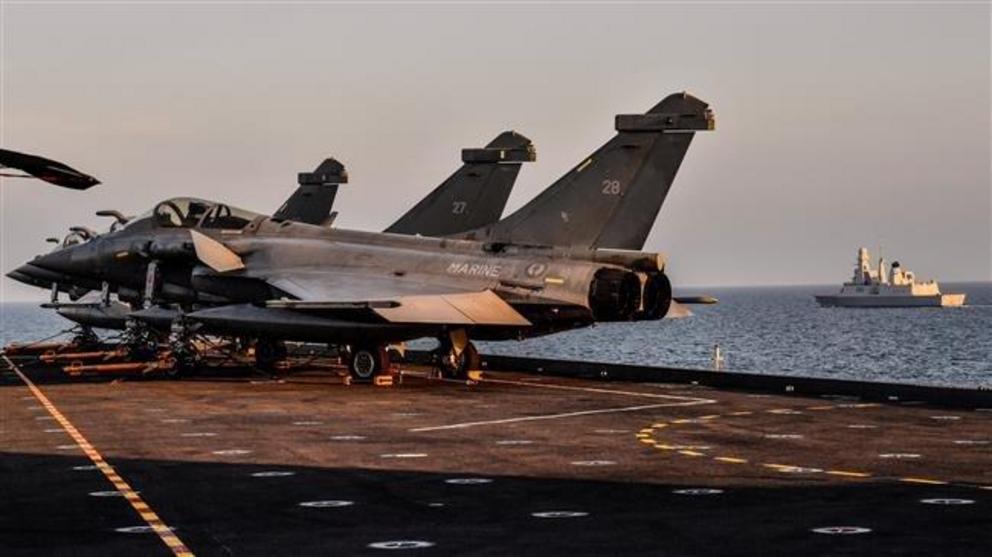 French Navy Rafale fighter jets are seen aboard the upgraded Charles de Gaulle aircraft carrier off the coast of Toulon, southern France, November. 14, 2018. (Photo by AP)