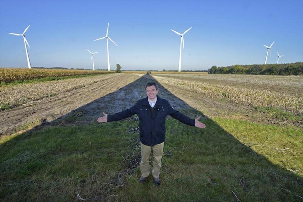Wind farmer Jan Marrink poses by his wind turbines in Nordhorn, Germany. (Martin Meissner / AP)