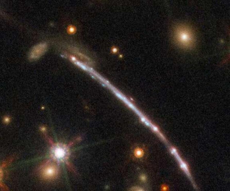 This image, taken with the NASA/ESA Hubble Space Telescope, shows one of four arcs formed of the light from the galaxy nicknamed the Sunburst Arc. Created by strong gravitational lensing, this bright arc of light consists of at least four copies of the im