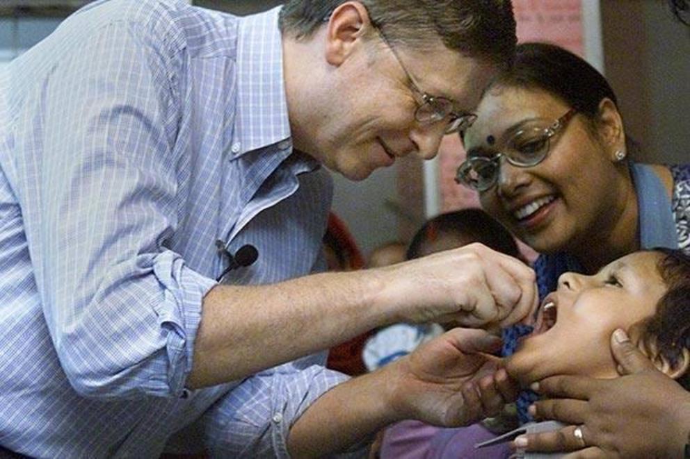 Bill Gates giving the oral polio vaccine to a child in India. Bill Gates is not a medical doctor, and does not have a license to practice medicine.