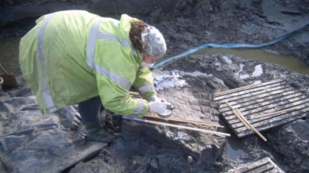 Archaeologists endeavored to prevent breaking the egg as they removed it.