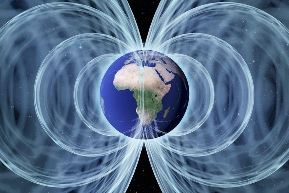 Earth’s magnetic field, shown here as white lines, helps the planet hold on to its atmosphere. Credit: SPL