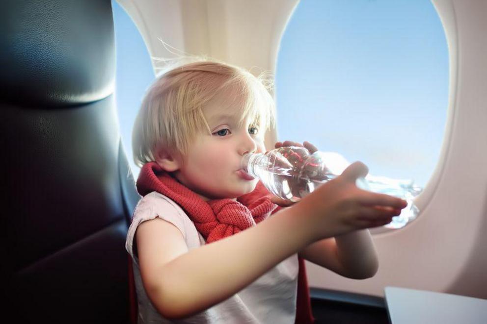 Drinking water while traveling on a plane can keep you from getting dehydrated.