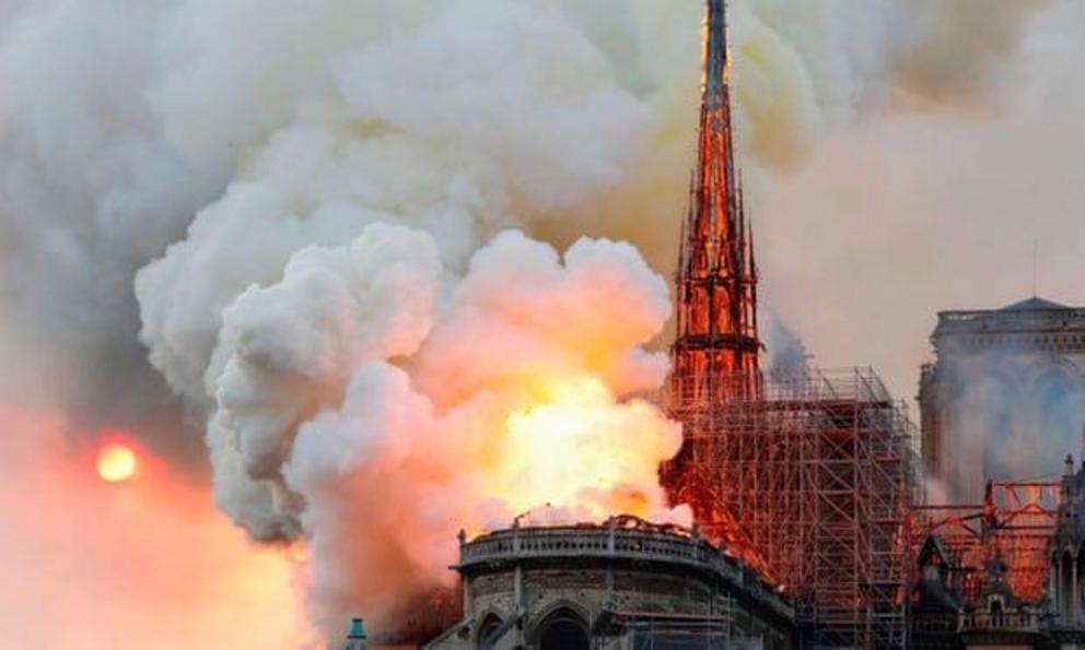 Smoke and flames rise during the fire at Notre Dame Cathedral in Paris. Photograph: François Guillot/AFP/Getty Images 