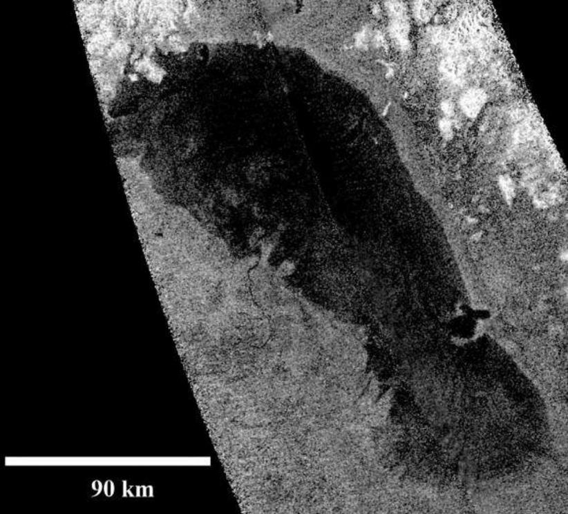 A Cassini radar image of Ontario Lacus (Lake Ontario) the first confirmed hydrocarbon on Titan. Ontario Lacus is at the moon’s south polar region.