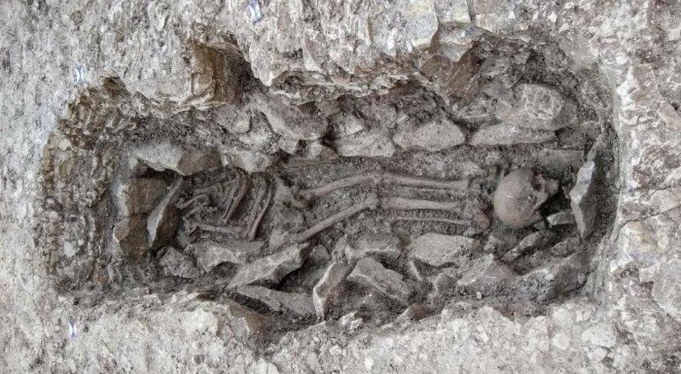  An image of Neolithic human remains that were found in a grave that was dug into the bedrock.