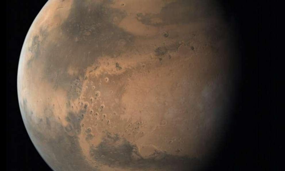 A view of Mars showing the planet's northern polar ice cap. A new study led by The University of Texas at Austin has found remnants of ancient ice caps buried in the north polar region.