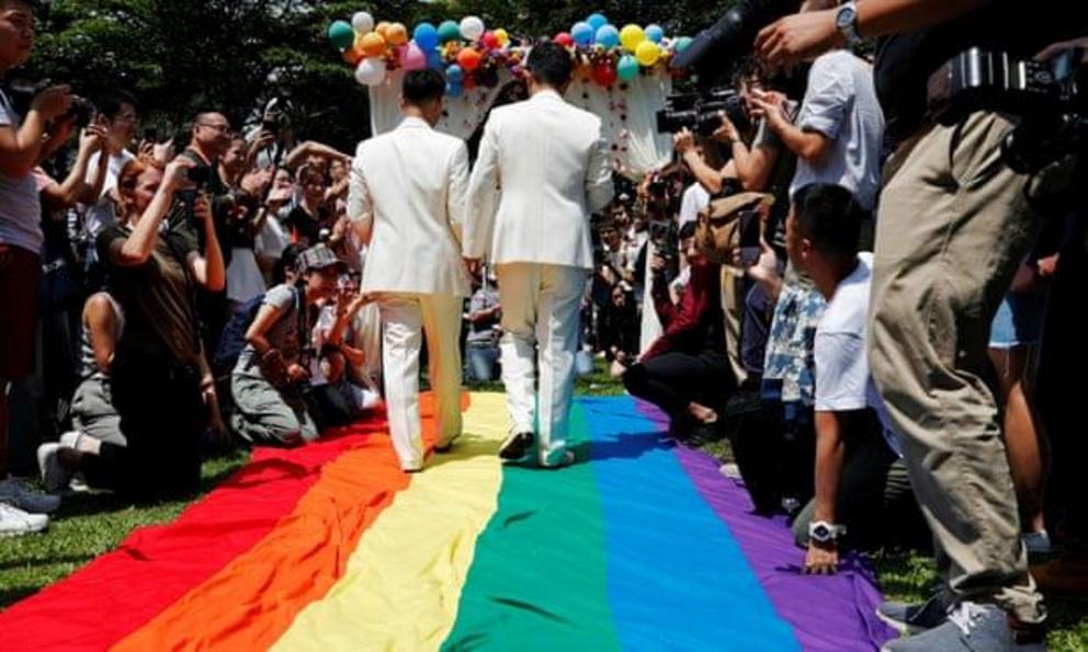 A couple celebrate after registering their marriage in Taipei.