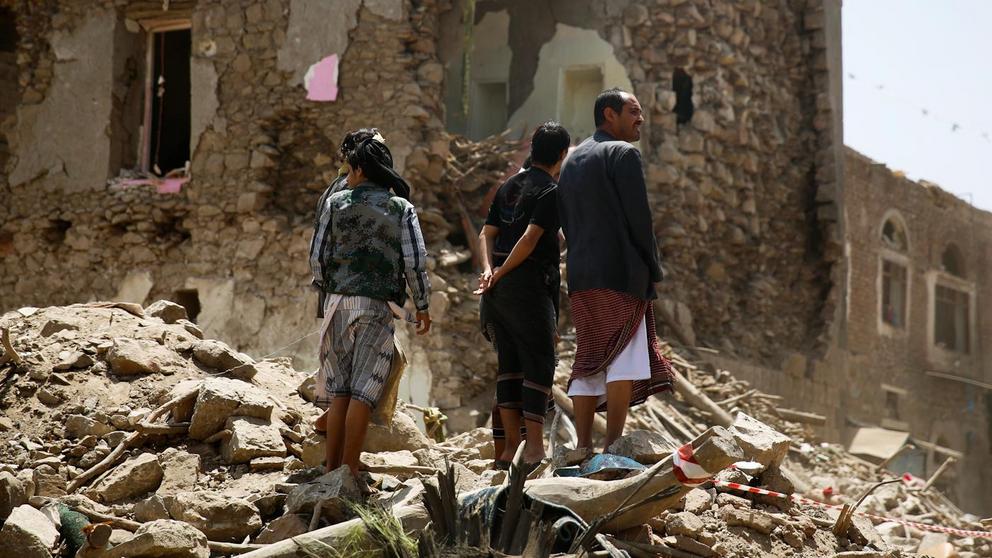 People stand amid the rubble of the site of a Saudi-led airstrike in the old city of Sana’a, Yemen, Sept. 19, 2015. The airstrikes hit an apartment building in the center of the capital, a UNESCO world heritage site, killing a family of nine. Hani Mohamme