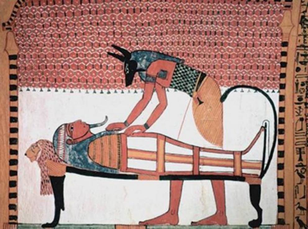 Anubis was the ancient Egyptian god associated with mummification and burial rituals, here he attends to a mummy.