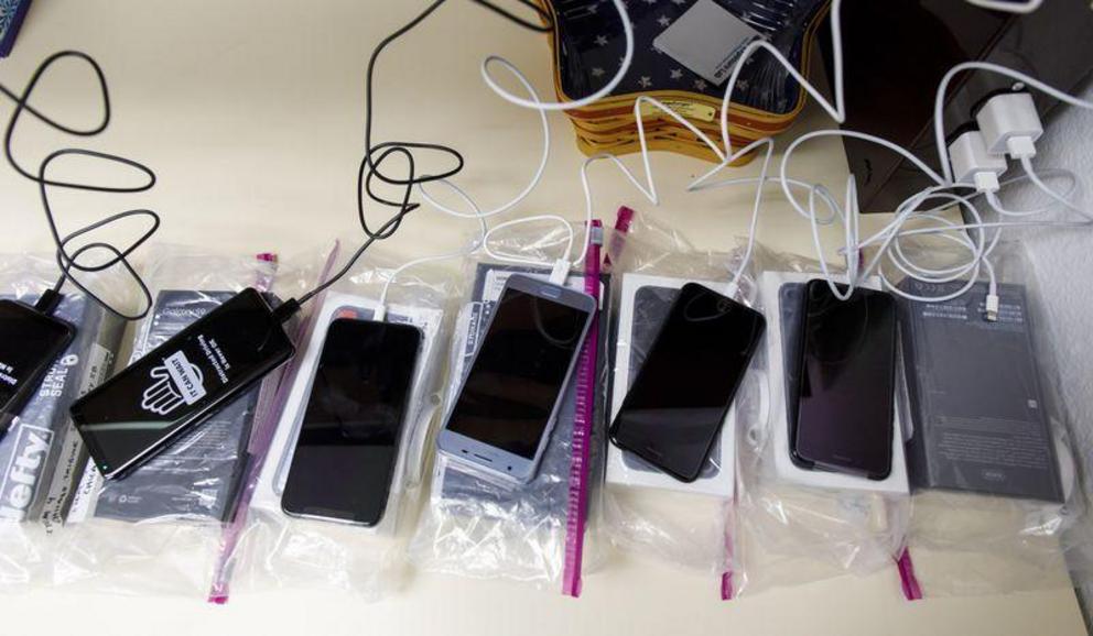 New cellphones are charged and prepped before being tested for radiofrequency radiation last year at the RF Exposure Lab in San Marcos, Calif. (Brian Cassella / Chicago Tribune)