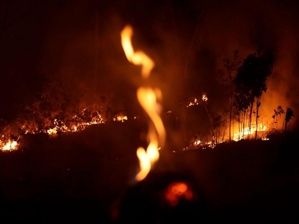 A fire burning along a highway in the city of Porto Velho, in Brazil’s Rondonia state, part of the Amazon.