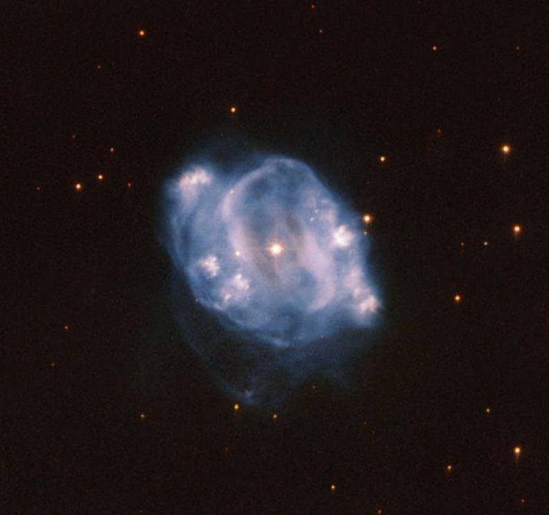 This Picture of the Week from the NASA/ESA Hubble Space Telescope shows NGC 5307, a planetary nebula which lies about 10000 light years from Earth. The white dwarf at the center lights up the gas as it expands. After about 10,000 years, the gas will be di