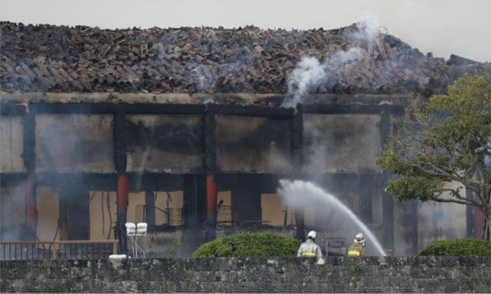 Firefighters try to extinguish a fire at Shuri Castle, listed as a world heritage site, in Naha on the southern island of Okinawa.