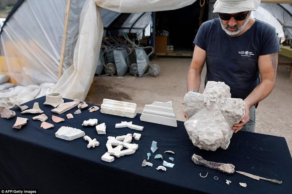 The Israel Antiquities Authority (IAA) is conducting large-scale excavations at the city of Beit Shemesh. Pictured in 2017 are marble (centre left), glass (centre right) and pottery (far left) fragments found during excavations, as well as a number of pie