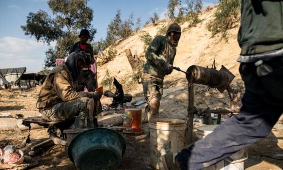 A group of zama zamas from Zimbabwe work behind the informal settlement of Matholesville.