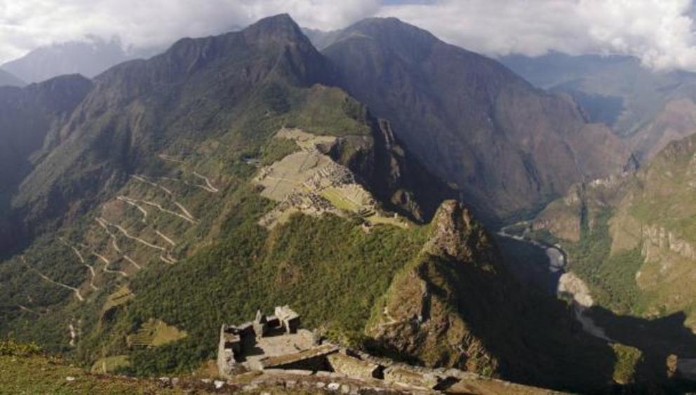 Machu Picchu and mountains and Inca roads seen from Wayna Picchu ruins.