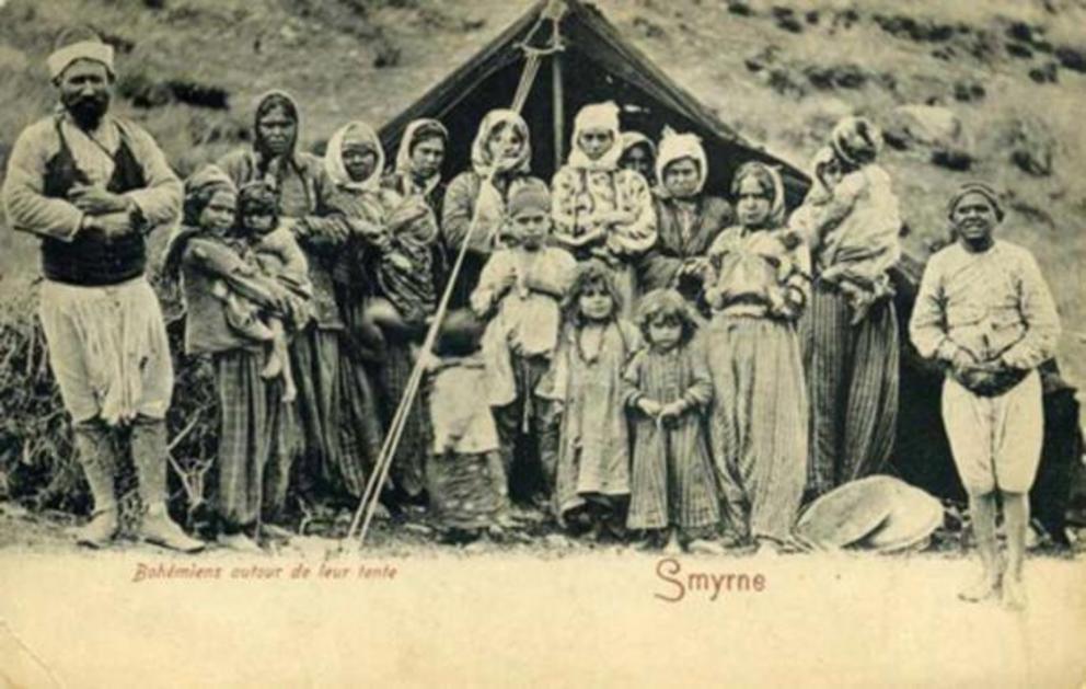 Pre-1903 postcard of group of Roma gypsies in front of their tent in Smyrne.