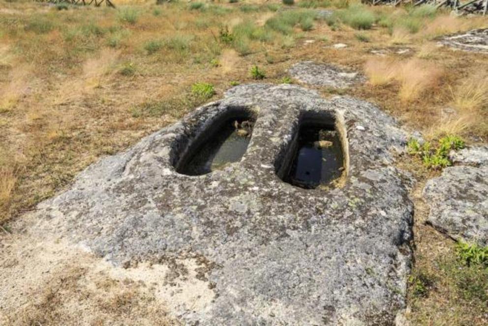 Rock-cut graves in Fornos de Algodres, Portugal , said to be the place where the Mouras knead bread.