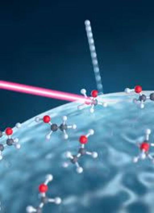 An intense laser pulse (red) hits a nanoparticle made of glass and interacts with molecules on its surface. Subsequently, as depicted, hydrogen ions may be detached, and the yield of such reactions can be measured by reaction nanoscopy. Credit: Alexander 