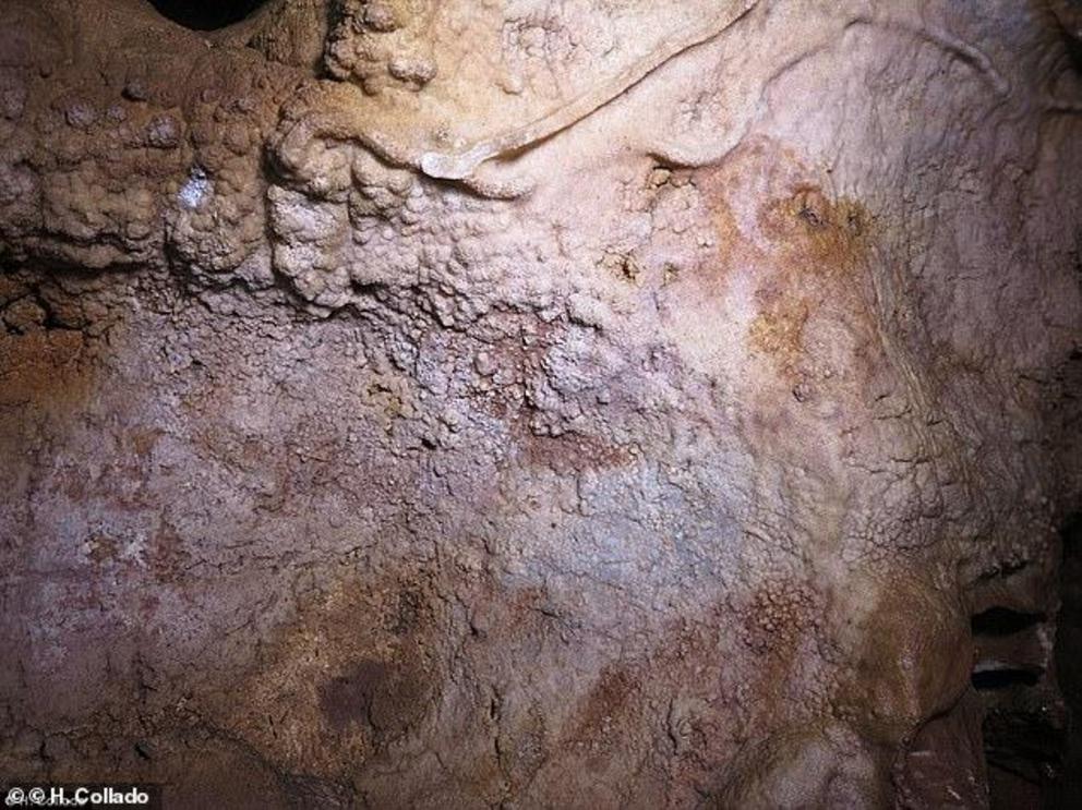 The study suggests Neanderthals invented art 20,000 years before modern humans thought of daubing pictures of prehistoric bison on cave walls. This cave wall in Maltravieso with Neanderthal hand stencils is almost completely covered with calcite. It is mo