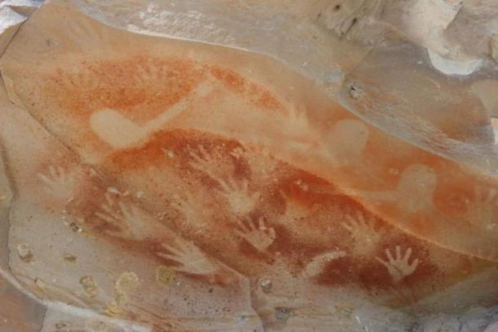 Aboriginal rock art (hafted stone axe and hand stencils) before the bushfire that destroyed the Baloon Cave in Queensland in 2018.