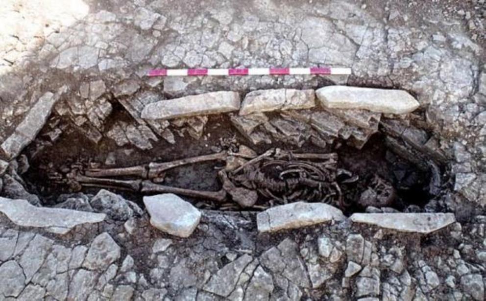 One of the Roman slave skeletons in the stone coffin structure unearthed at the burial site in Britain.