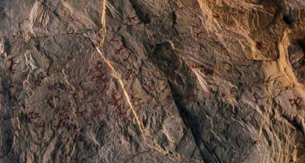 All of the rock art was a dark red color but had faded.
