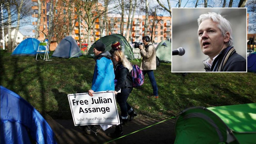 Supporters of Julian Assange (inset) outside Woolwich Crown Court this week. © REUTERS/Henry Nicholls 