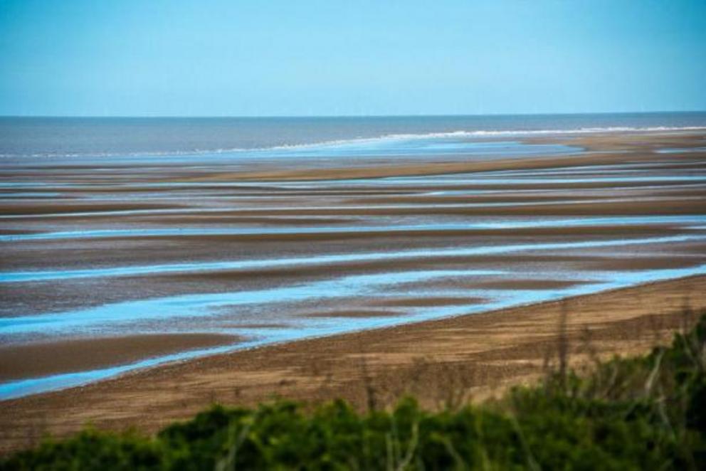Old Hunstanton beach, where Seahenge was found, at low tide in Norfolk, UK.