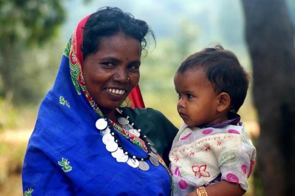 Smiling Adivasi women and child from Chhattisgarh, India.