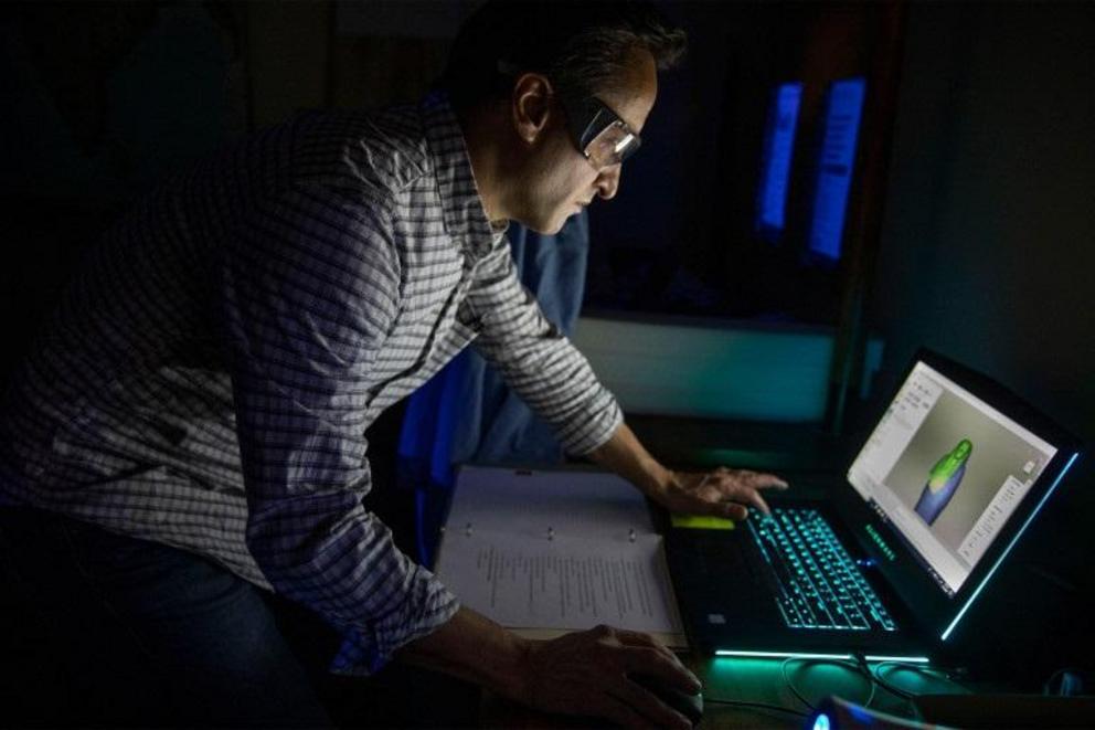 Adam Aja works on 3D images of the coffin of Mut-iy-iy.